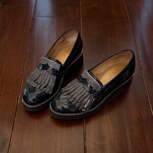 The Office of Angela Scott Elegant Patent Black Loafers with Fringe Detail